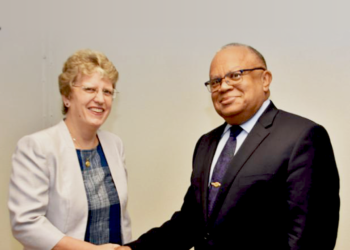 British High Commissioner to Barbados and the Eastern Caribbean, Janet Douglas and Barbados' Minister of Foreign Affairs and Foreign Trade, Senator Dr. Jerome Walcott shaking hands.