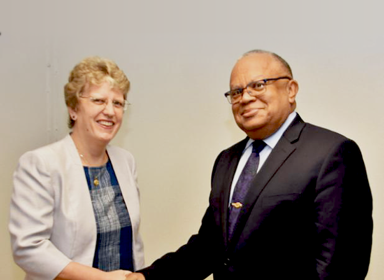 British High Commissioner to Barbados and the Eastern Caribbean, Janet Douglas and Barbados' Minister of Foreign Affairs and Foreign Trade, Senator Dr. Jerome Walcott shaking hands.